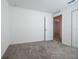 Well-lit bedroom with grey carpet, an interior door, and window at 2327 Sw 168Th Loop, Ocala, FL 34473