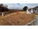 Large backyard with chain link fence and dry grass at 9981 Sw 59Th Cir, Ocala, FL 34476