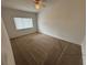 Spacious bedroom with carpeted floors and a window at 9981 Sw 59Th Cir, Ocala, FL 34476