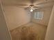 Bright bedroom featuring ceiling fan and carpet flooring at 9981 Sw 59Th Cir, Ocala, FL 34476