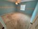 Spacious bedroom with light blue walls and carpeted floor at 9981 Sw 59Th Cir, Ocala, FL 34476