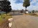House exterior with driveway and landscaping at 9981 Sw 59Th Cir, Ocala, FL 34476