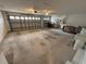 Two-car garage with concrete floor and shelving at 9981 Sw 59Th Cir, Ocala, FL 34476