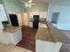 Galley kitchen with granite countertops and dark wood cabinets at 9981 Sw 59Th Cir, Ocala, FL 34476