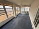 Sunroom with ample windows and carpeted floor at 9981 Sw 59Th Cir, Ocala, FL 34476