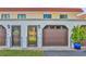 Condo exterior with two garages and entrance at 14 Ocean Palm Villa S # 14, Flagler Beach, FL 32136