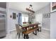 Charming dining area with a rustic wood table and bench at 1658 Ne 162Nd Pl, Citra, FL 32113