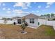 Backyard view of house with fenced in area at 348 Hickory Course Radl, Ocala, FL 34472