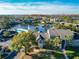 Community with lake, pool, and apartment buildings at 4704 Walden Cir # 21, Orlando, FL 32811