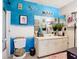 Bathroom with teal walls, a vanity with a white sink and toilet at 4704 Walden Cir # 21, Orlando, FL 32811