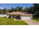 House with a spacious yard, driveway, and a peaceful neighborhood at 13589 Se 100Th Ave, Belleview, FL 34420