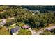 Two houses on a residential street surrounded by lush greenery at 13589 Se 100Th Ave, Belleview, FL 34420