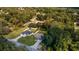 Two houses on a residential street surrounded by lush greenery at 13589 Se 100Th Ave, Belleview, FL 34420