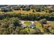 Aerial view of a house and its surrounding landscape at 13589 Se 100Th Ave, Belleview, FL 34420