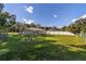 Large backyard with a grassy area and a view of the house at 13589 Se 100Th Ave, Belleview, FL 34420