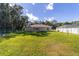 View of the house from the backyard, showcasing a large lawn at 13589 Se 100Th Ave, Belleview, FL 34420