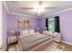 Large bedroom with plush bed and neutral decor at 13589 Se 100Th Ave, Belleview, FL 34420