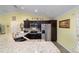 Spacious kitchen with granite countertops and stainless steel appliances at 13589 Se 100Th Ave, Belleview, FL 34420
