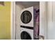 Laundry room with LG stackable washer and dryer, and additional storage at 13589 Se 100Th Ave, Belleview, FL 34420