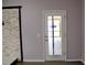 White door with glass panels leading to backyard at 369 James Cir, Lake Alfred, FL 33850