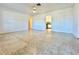 Living room with view into kitchen and terrazzo floor at 1609 S Page Dr, Deltona, FL 32725