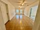 Spacious living room featuring tile flooring and ceiling fan at 1609 S Page Dr, Deltona, FL 32725