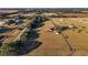 High-angle view of a house on a large lot with surrounding land at 20690 Sw 36Th St, Dunnellon, FL 34431