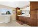 Elegant bathroom with double vanity and wood cabinets at 20690 Sw 36Th St, Dunnellon, FL 34431