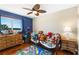 bedroom with wood floors, built-in dresser, and toy storage at 20690 Sw 36Th St, Dunnellon, FL 34431