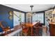 Formal dining room with dark blue walls and wood table at 20690 Sw 36Th St, Dunnellon, FL 34431