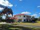 Two-story house with red roof and large yard at 20690 Sw 36Th St, Dunnellon, FL 34431