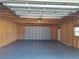 Unfinished garage interior with concrete floor and overhead door at 20690 Sw 36Th St, Dunnellon, FL 34431