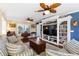 Spacious living room with built-in shelving and hardwood floors at 20690 Sw 36Th St, Dunnellon, FL 34431