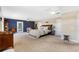 Spacious main bedroom with outdoor access and carpeted floors at 20690 Sw 36Th St, Dunnellon, FL 34431