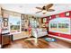 Home office with hardwood floors, large windows, and lots of wall space for displaying framed items at 20690 Sw 36Th St, Dunnellon, FL 34431