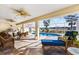 Relaxing screened-in pool area with patio furniture and a built-in grill at 20690 Sw 36Th St, Dunnellon, FL 34431
