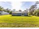 House with large backyard, green grass and trees at 8873 Sw 139Th Place Rd, Ocala, FL 34473