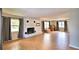 Living room featuring a fireplace and hardwood-style tile floors at 103 13Th Se St, Winter Haven, FL 33880