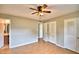 Spacious bedroom with wood-look floors and double closets at 103 13Th Se St, Winter Haven, FL 33880