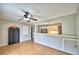 Living room with kitchen bar and hardwood floors at 103 13Th Se St, Winter Haven, FL 33880