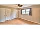 Spacious bedroom with ample closet space and wood-look floors at 103 13Th Se St, Winter Haven, FL 33880