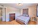 Bright bedroom with wood floors, double closet, and dresser at 103 13Th Se St, Winter Haven, FL 33880