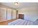 Bedroom with double closet and wood floors at 103 13Th Se St, Winter Haven, FL 33880