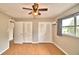 Bright bedroom with double closets and wood-look flooring at 103 13Th Se St, Winter Haven, FL 33880