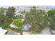 Property's aerial view, highlighting its location near a lake and road at 103 13Th Se St, Winter Haven, FL 33880