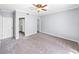 Spacious bedroom with ceiling fan and ample closet space at 301 Laurel Cove Way # 111, Winter Haven, FL 33884