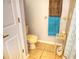 Small bathroom with toilet and teal shower curtain at 948 Old Cutler Rd, Lake Wales, FL 33898