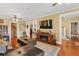 Spacious living room featuring hardwood floors, a fireplace, and comfortable seating at 350 E Park Ave, Lake Wales, FL 33853
