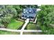 Two story home with wrap around porch and landscaped yard at 350 E Park Ave, Lake Wales, FL 33853