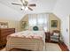 Serene bedroom with a patchwork quilt and a ceiling fan at 350 E Park Ave, Lake Wales, FL 33853